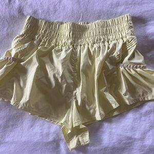 FP Movement by Free People Light Yellow Athletic Shorts